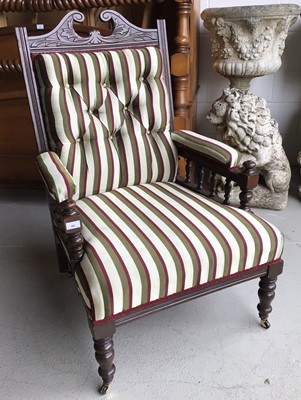 Lot 68 - Late Victorian carved mahogany armchair with striped button upholstery on turned front feet H106, W68, D75cm