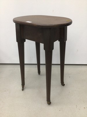 Lot 52 - 19th century mahogany side table/stool with circular top on tapered legs terminating on brass castors, possibly associated parts, top 47cm x 34cm, 71cm high