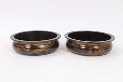 Lot 805 - Pair 19th century turned wood wine coasters with black and gilt lacquered vine decoration 15.5cm diameter