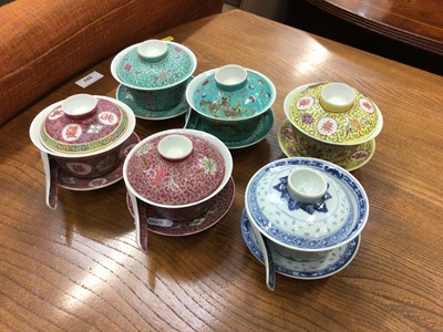 Lot 564 - Six decorative Chinese porcelain rice cups, covers and stands, together with four rice spoons