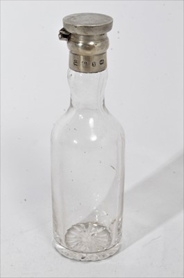 Lot 441 - Victorian silver mounted glass bottle, possibly for whisky, with hinged cover, (Birmingham 1897), maker Hukin & Heath, 13.5cm in overall height