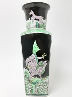 Lot 150 - Chinese famille noire porcelain vase, 19th/20th century, of tapered rectangular form, painted with dragons on each side, with fish and horses around the neck, six-character Kangxi mark to base, 36c...