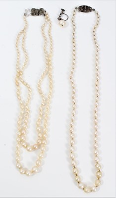 Lot 452 - Cultured pearl necklace with a string of graduated cultured pearls measuring approximately 7.2mm to 3.3mm (incorporating seven simulated pearls) on a diamond clasp, together with a two-strand cultu...