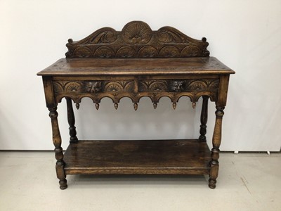 Lot 208 - Carved oak side table H104, W106, D39cm