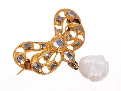 Lot 459 - Antique diamond and pearl bow brooch with a gold bow set with square flat cut diamonds in closed back setting, suspending a baroque pearl pendant drop. Pearl not tested for natural origin. 31mm.