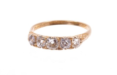 Lot 487 - Edwardian diamond five stone ring with five old cut cushion shape diamonds in carved gold claw setting on plain gold shank . Estimated total diamond weight approximately 1ct. Finger size approximat...