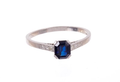 Lot 490 - Art Deco sapphire and diamond platinum ring with an octagonal step cut blue sapphire measuring approximately 6.15mm x 5.15mm x 3.05mm, with six single cut diamonds to the shoulders on platinum shan...