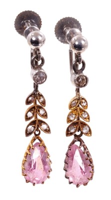 Lot 491 - Pair of Edwardian pink topaz and diamond pendant earrings, each with a pear cut pink topaz suspended from rose cut diamond foliage and collet set old cut diamond, with 9ct white gold screw fittings...