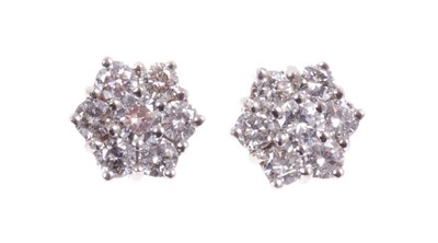 Lot 494 - Pair of diamond cluster earrings, each flower head cluster comprising seven brilliant cut diamonds in 18ct white gold setting. Estimated total diamond weight approximately 1.4cts. Diameter approxim...