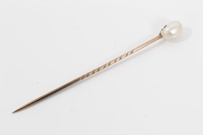 Lot 495 - Antique natural pearl stick pin with an oval natural pearl (saltwater) measuring approximately 5.8mm x 6mm x 8.5mm. Accompanied by a Pearl Report by The Gem & Pearl Laboratory dated 2014.