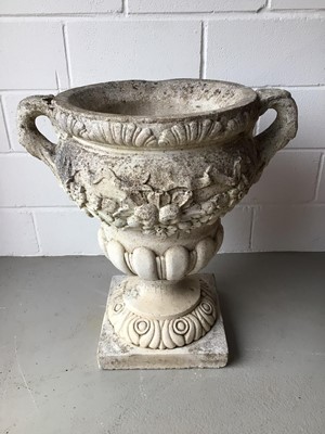 Lot 151 - Large concrete urn with floral decoration and twin handles on square base H76, W68, D49cm