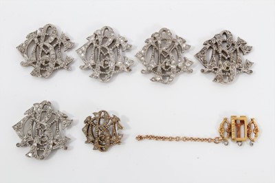 Lot 513 - Set of five Edwardian diamond monograms, each openwork plaque set with single cut diamonds in millegrain setting, probably originally applied to a silk band, together with a matching clasp. Largest...