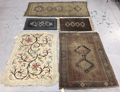 Lot 1403 - Small group of rugs including Chinese blue ground rug, 100 x 55cm, Pakistani small rug, felt-work rug 125 x 151cm and two worm Persian rugs.