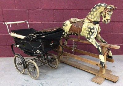 Lot 1358 - Antique painted wooden rocking horse and a vintage child's perambulator