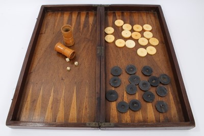 Lot 873 - 19th century mahogany backgammon box, the interior inlaid with board and with set 15 ivory and  horn backgammon pieces, pair of turned boxwood shakers and three bone dice.