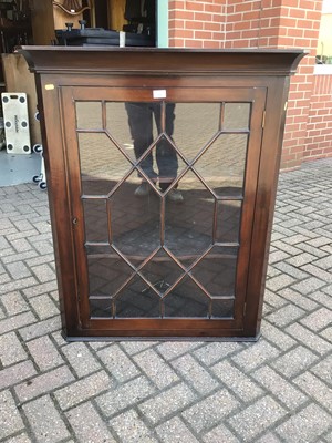 Lot 185 - Georgian mahogany hanging corner cupboard enclosed by astragal glazed door, t