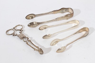 Lot 408 - Pair of Georgian silver scissor action sugar nips, c.1760, together with three pairs of silver sugar tongs (various dates and makers), all at 7oz (4)