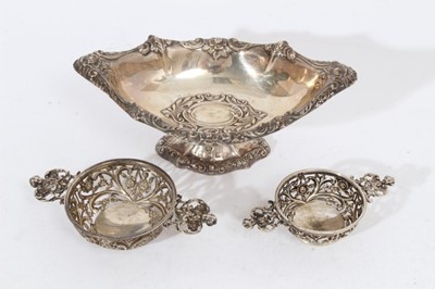 Lot 435 - Victorian silver bonbon dish of navette form with embossed decoration (Birmingham 1895), together with two graduated Victorian silver Quaiches with pierced decoration (London 1893), maker William C...