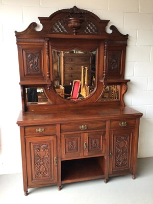 Lot 186 - Edwardian carved walnut two height sideboard with bevelled mirror back, three drawers and carved panelled doors below, 154cm wide, 54cm deep, 228cm high