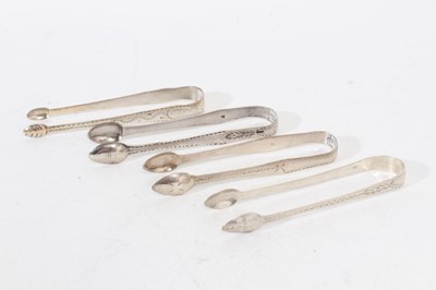 Lot 475 - 4 pairs of George III Exeter silver sugar tongs, with bright cut engraved decoration