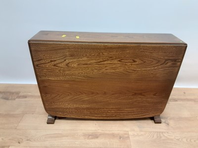 Lot 242 - Ercol elm drop leaf coffee table, opening to 103cm x 68cm, 46.5cm high