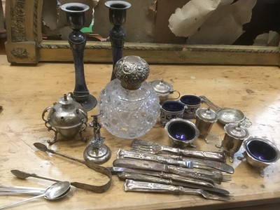 Lot 697 - Large silver topped scent bottle, various other silver including cutlery, tea strainer, cruet set, menu holder, pair of Art Nouveau style candlesticks, oil lamp