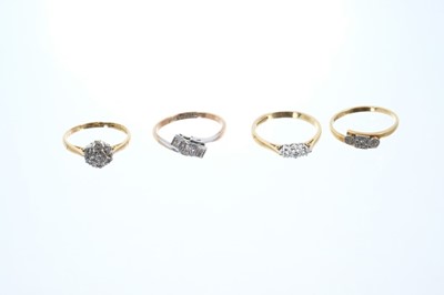 Lot 570 - Diamond three stone ring in 18ct gold setting and three 9ct diamond rings in illusion setting