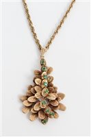Lot 3413 - Gold (9ct) leaf pendant set with nine emeralds,...
