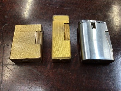 Lot 112 - Vintage Dunhill gold plated pocket lighter, Dupont pocket lighter and a Ronson lighter (3)