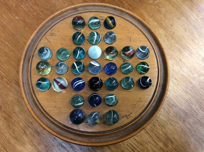 Lot 30 - Vintage solitaire board and two sets of marbles