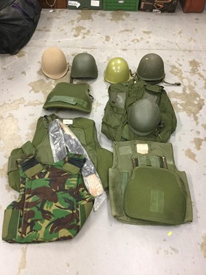 Lot 790 - Group of modern military helmets, together with body armour and other military uniforms