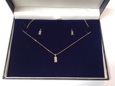 Lot 672 - Diamond pendant in 9ct gold setting and matching pair earrings