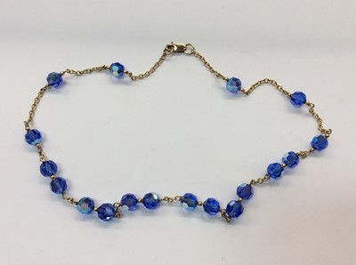Lot 675 - Vintage borrelli blue faceted iridescent glass bead with 9ct gold clasp