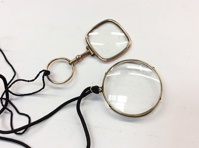 Lot 491 - Yellow metal spy glass and monocle (2)