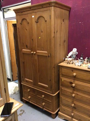 Lot 875 - Pine wardrobe with panelled doors , two short and one long drawer below 90 cm wide and pine chest of two short and three long graduated drawers 116 cm wide (2)