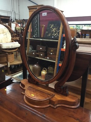 Lot 1031 - Late Victorian mahogany swing mirror with draw