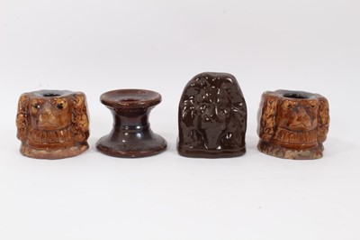 Lot 169 - Four treacle glazed stoneware sash window stops