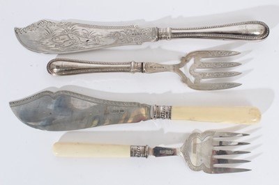 Lot 377 - Pair of Victorian silver fish servers with engraved and pierced silver blades and silver handles