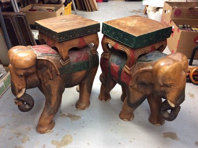 Lot 454 - Two large carved wooden elephant stools, two carved wooden African f ignores, and a large wood-effect Buddha (5)