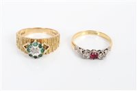 Lot 3418 - Gold (18ct) ruby and diamond three stone ring...