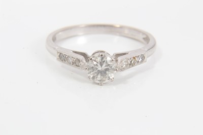 Lot 122 - 18ct white gold diamond solitaire ring with diamond set shoulders