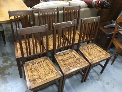 Lot 898 - Set of six 1920's Oak dining chairs with drop in rush seats, 93cm in overall height, seats 45cm in height (6)