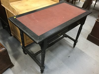 Lot 908 - Late Victorian ebonised wood writing table with inset vinyl top, pair of draws, turned legs joined by stretcher, raised on ceramic casters, 75 x 106 x 57cm