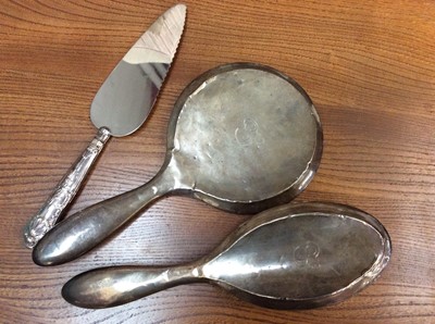 Lot 664 - Silver backed dressing table mirror and brush, silver handled cake knife, cutlery and bijouterie