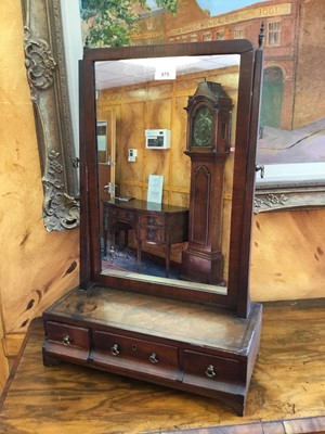 Lot 975 - George III mahogany toilet mirror with rectangular plate above a plateau base containing three drawers, on bracket feet