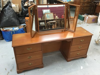 Lot 922 - Stag Dressing table with mirrored back above an arrangement of six draws, with central knee hole, together with a similar Stag chest of three draws (2)
