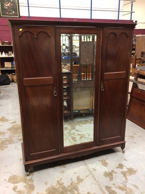 Lot 1023 - Bedroom suit comprising of a triple wardrobe, bed headboard and dressing table