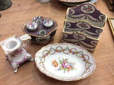 Lot 451 - Four pieces of Dresden porcelain to include a letter rack, chamber stick, inkwell and dish