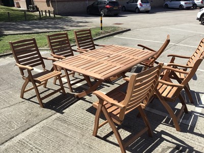 Lot 1013 - Teak garden table and 7 folding chairs