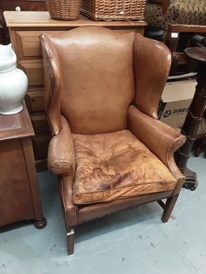 Lot 969 - Georgian- style wing chair with leather upholstery on taper legs